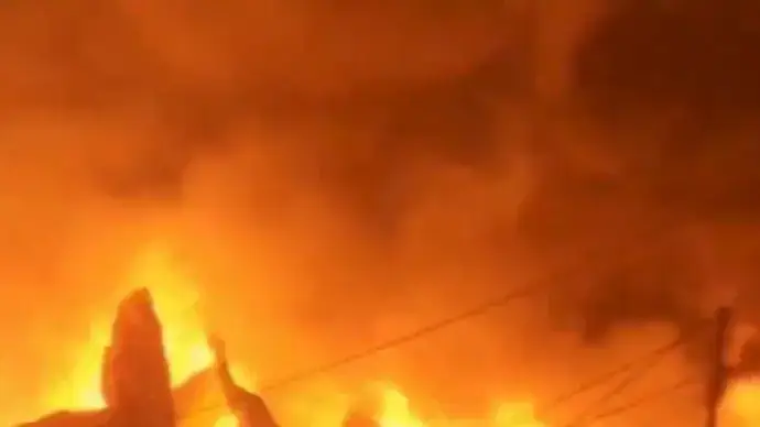 A Large Flame Ignites an Oil Tanker Godown in Vijayawada, With thick Smoke Plumes Visible Rising