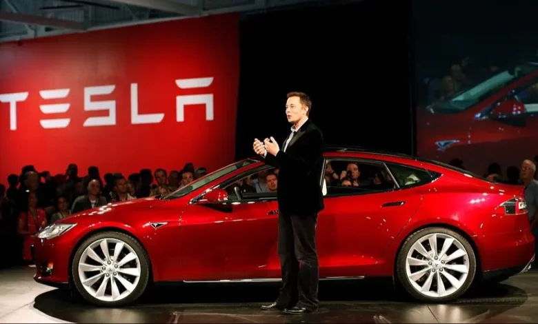 Tesla Faces Wave of Layoffs and Hiring Freeze Amidst Restructuring Efforts