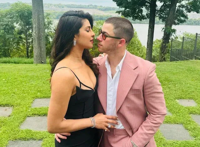 Priyanka Chopra Wows in A Black Dress, Nick Jonas Dapper in Pink Suit at A Family Wedding