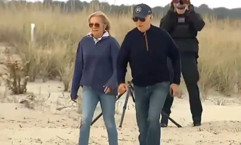 Biden struggles while walking on Delaware beach