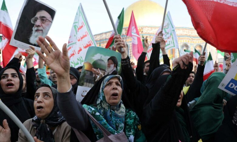 Regime change talk echoes among Iranians fleeing